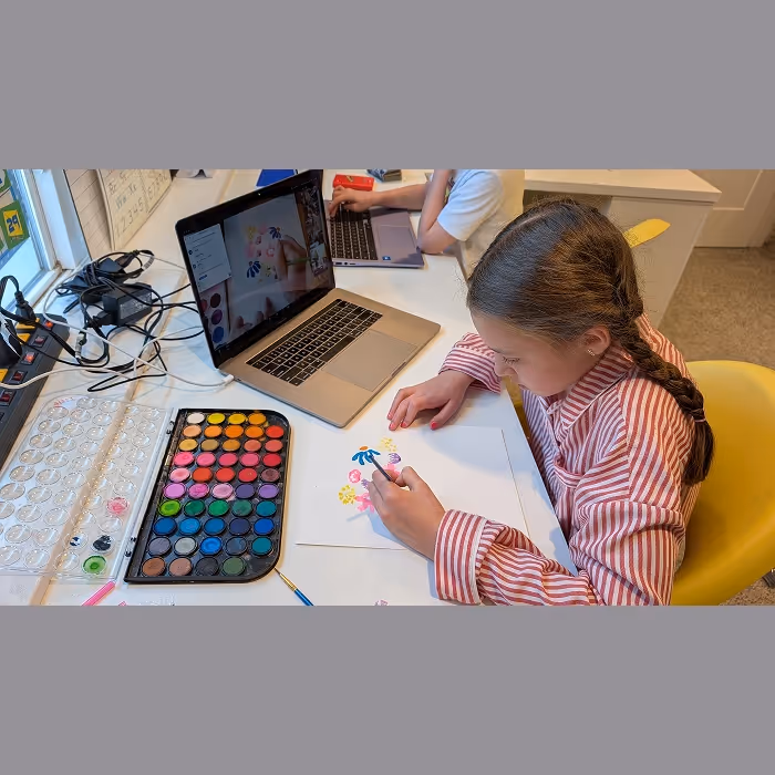 A young girl painting. 