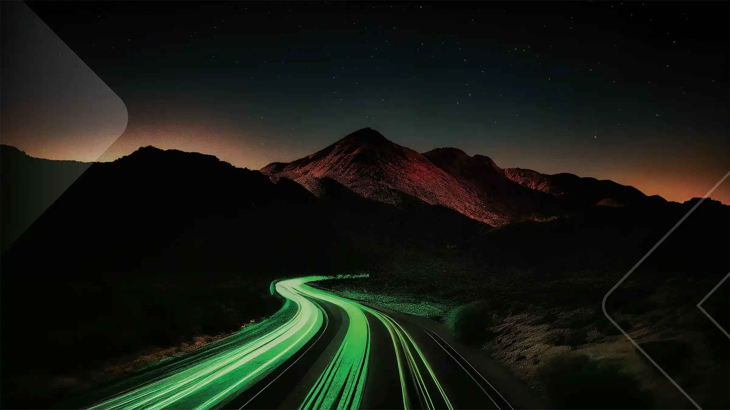 A long exposure shot of cars at night in the desert.