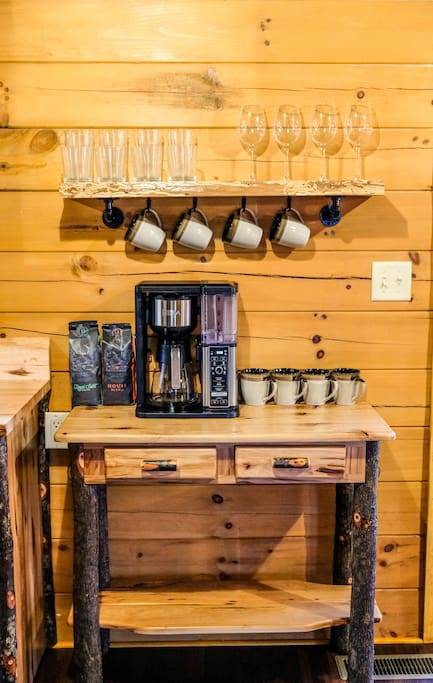Coffee nook with complimentary coffee, creamer and sugar