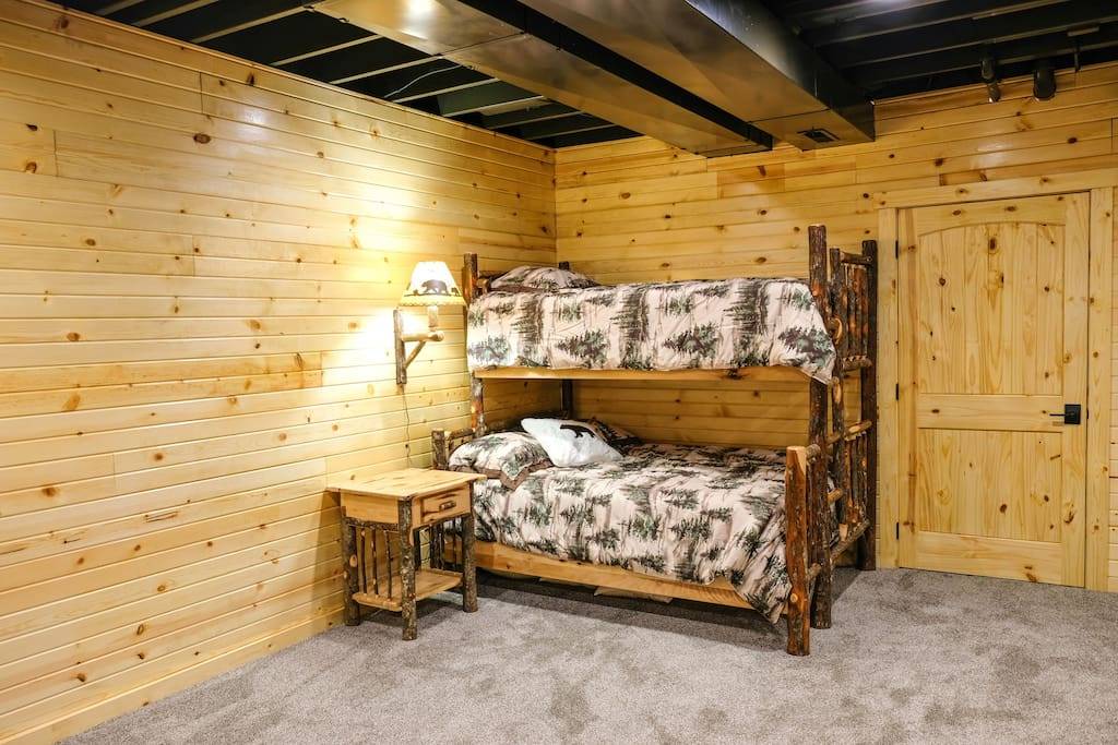 Twin-over-full hickory bunk bed in the basement