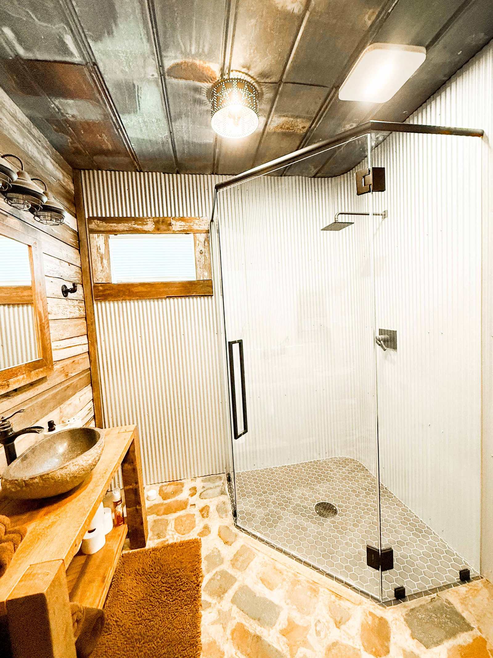 Full bathroom in the basement with a glass shower
