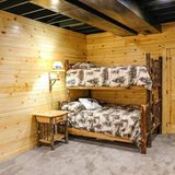 Twin-over-full hickory bunk bed in the basement