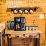 Coffee nook with complimentary coffee, creamer and sugar