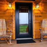 Front porch entrance with hickory rocking chairs at Deer Creek Cabin