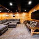 Basement movie night and hangout area with a 70-inch smart TV