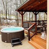 Hot tub on the patio at The Oaks, open year-round