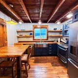 Full kitchen stocked with basic cooking supplies