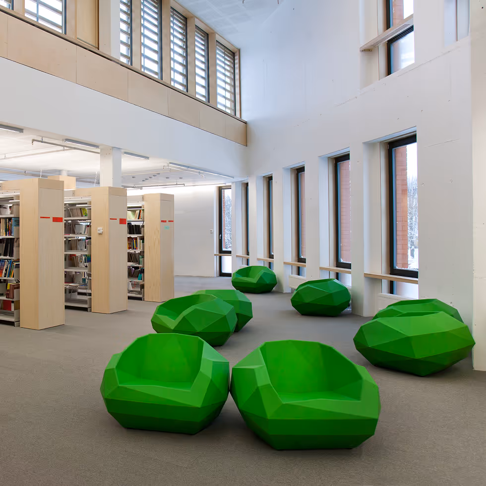 college library with beige and white paint and green chairs