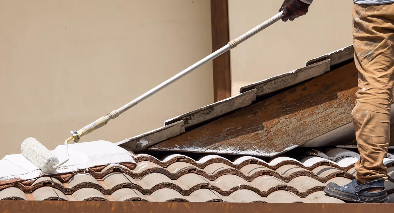 worker cleaning a residential roof