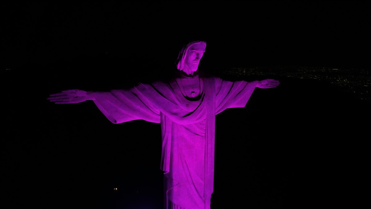 Cristo Redentor será iluminado de lilás em homenagem ao fim da violência contra meninas e mulheres