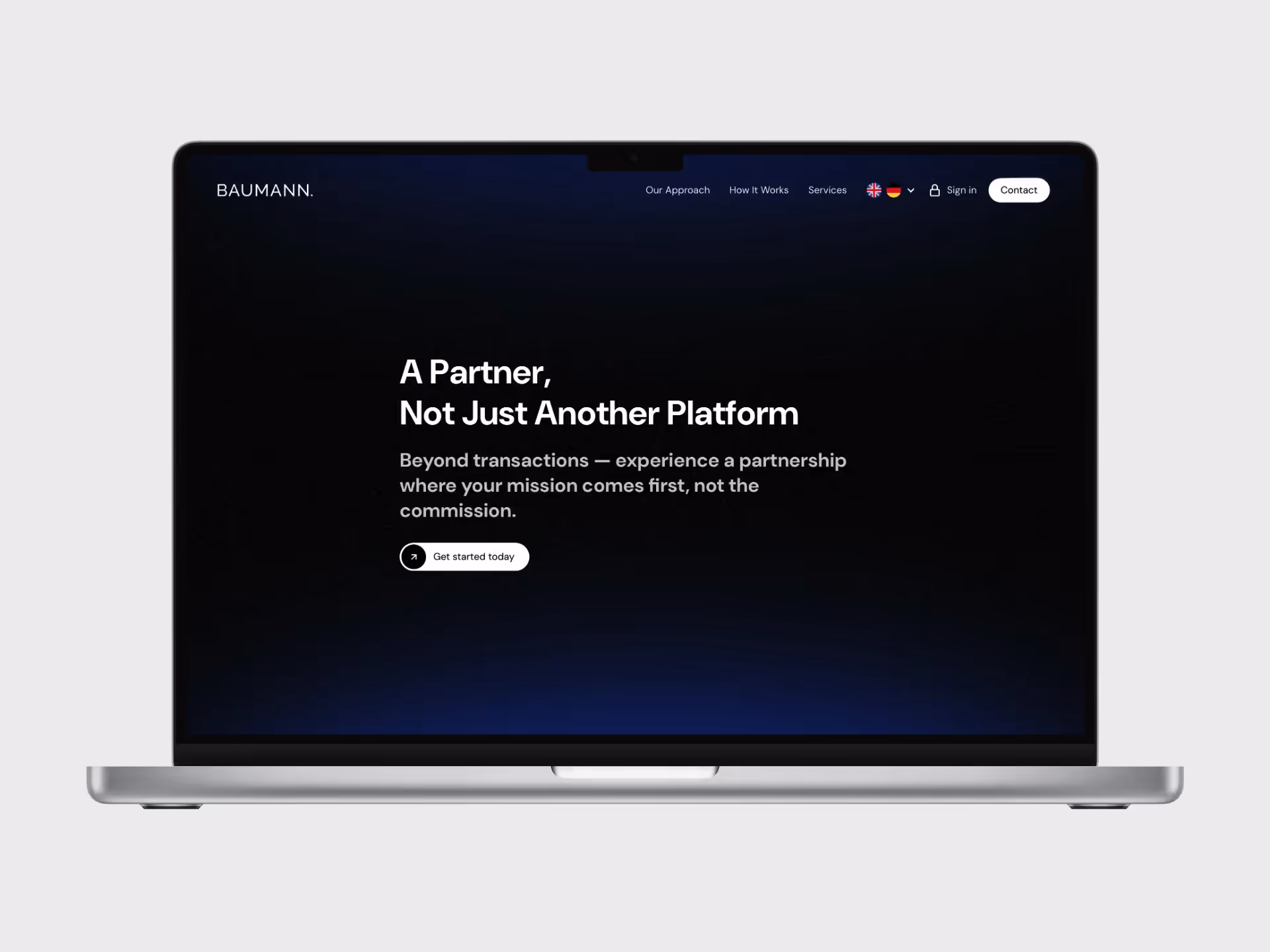 A photo realistic mockup of the Baumann website on a macbook