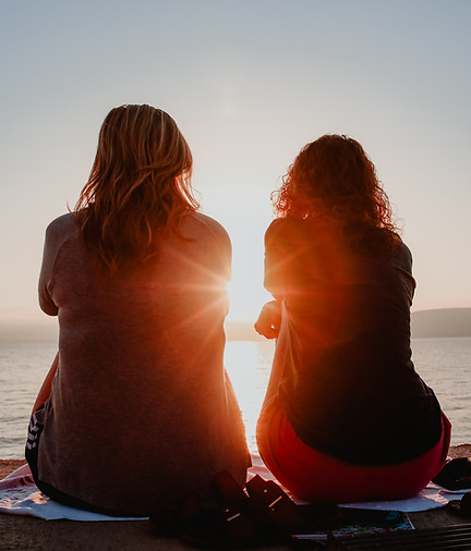 two women, sunset, comfort, mourning, community, connection