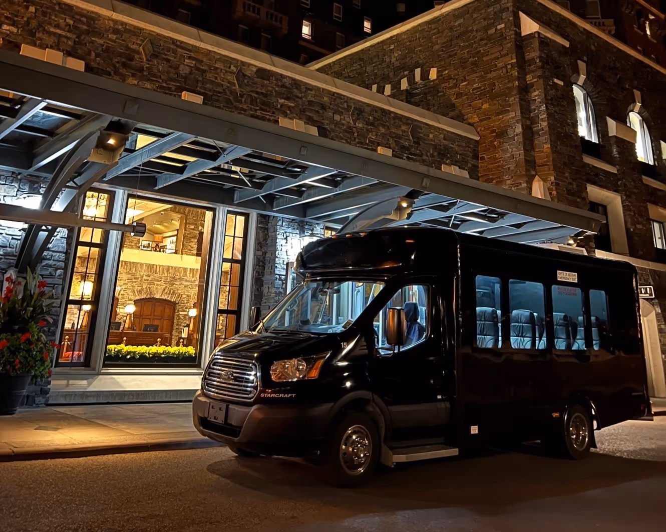 The Panorama Transportation bus in front of a hotel in Canada. 