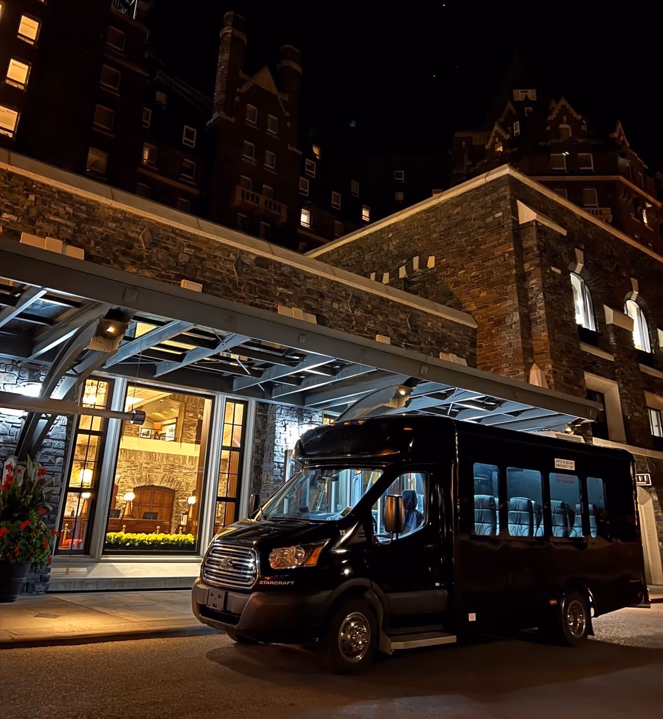 Panorama Tours bus outside of a hotel in Canada.