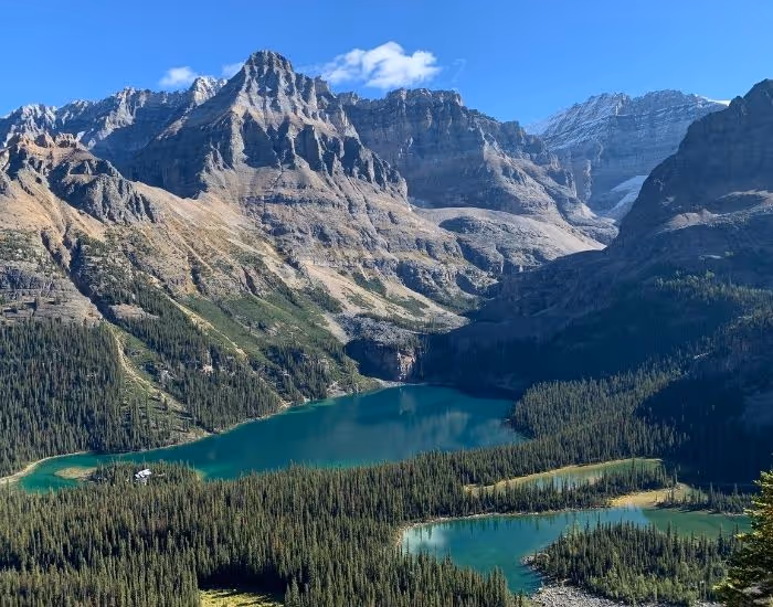 Canadian mountain range with blue lakes at the base of huge granite massifs. 