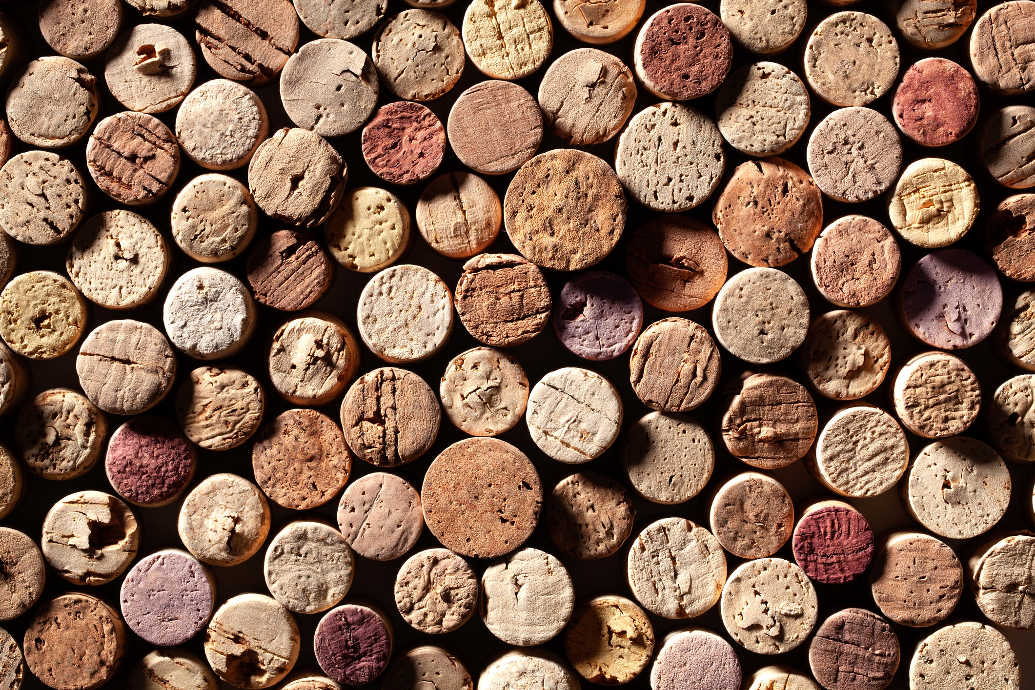 Top down view of used winecorks wallpapered together. Image: MALERAPASO/ISTOCK