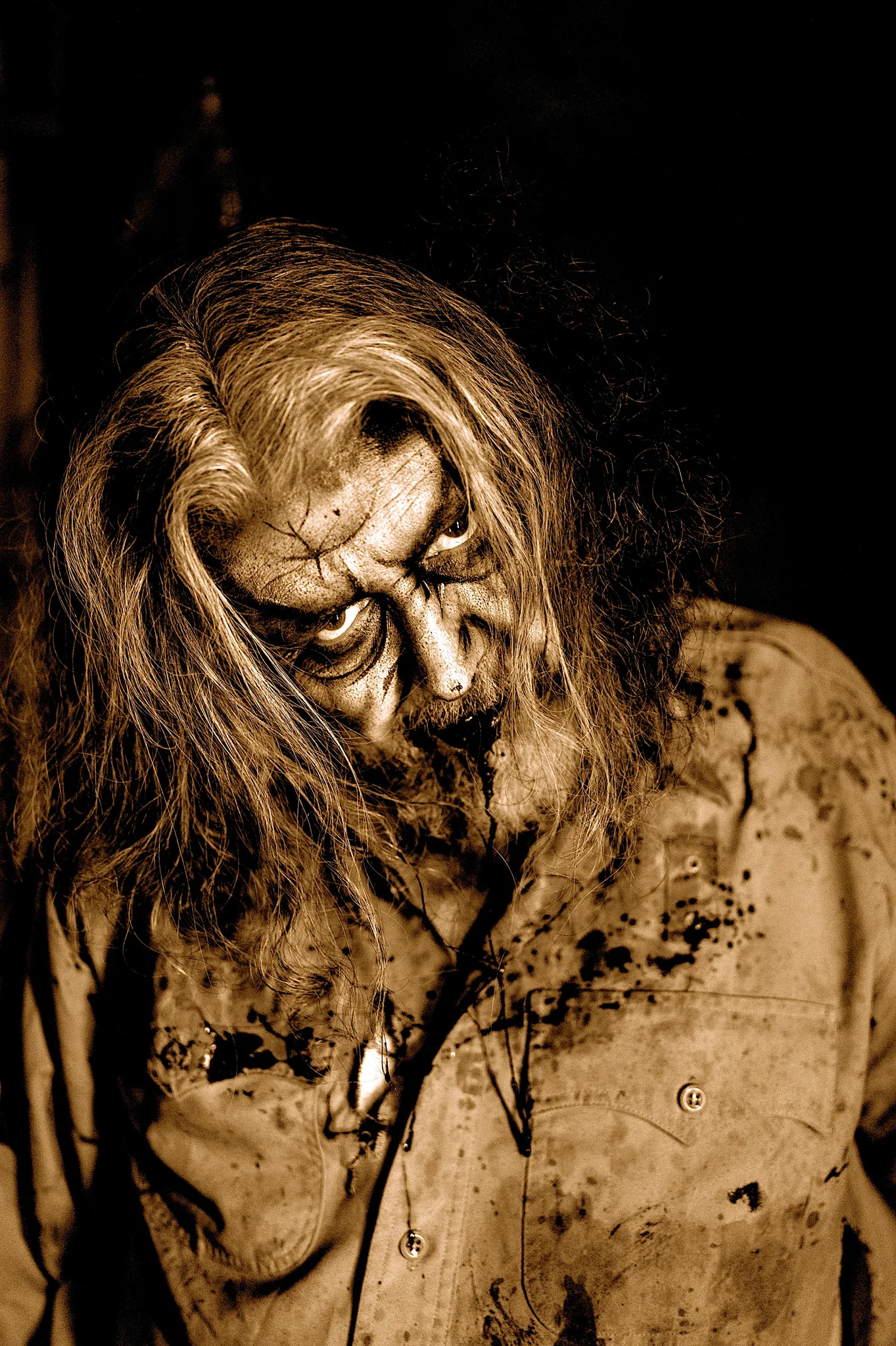 Sepia portrait of the Warden at Dark Prison.