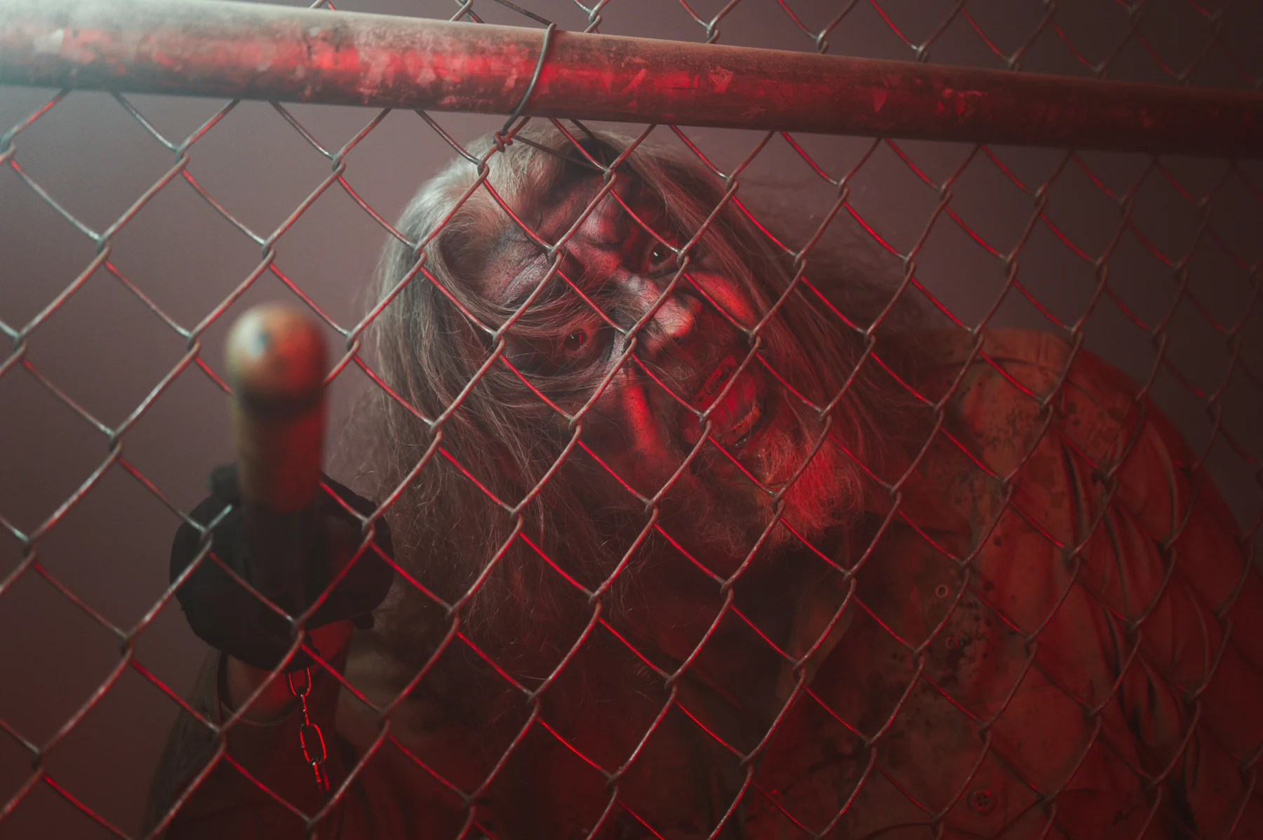 A Dark Prison performer behind the fence