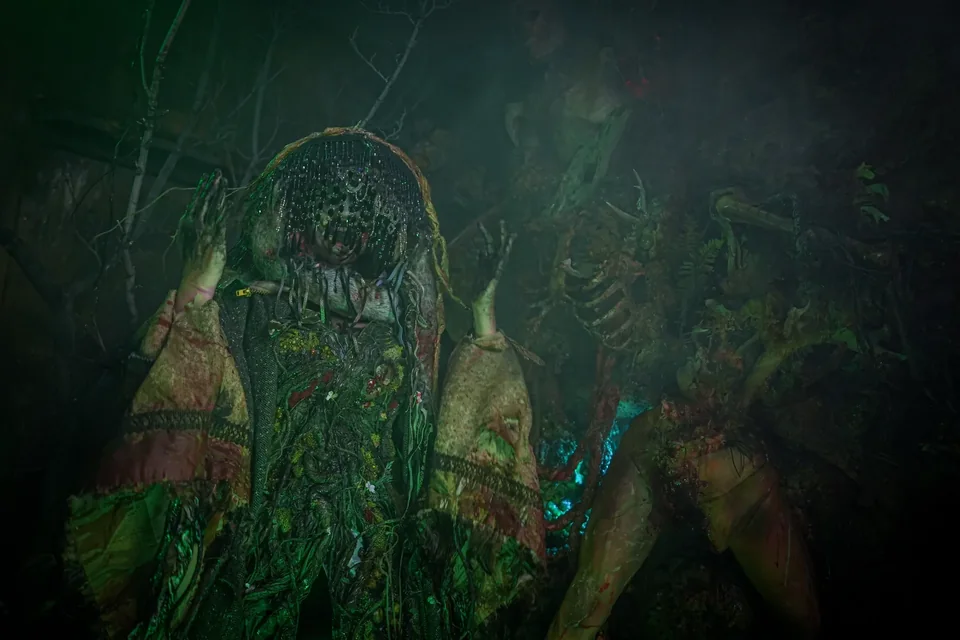 A foliage-covered creature within a dark forest set.