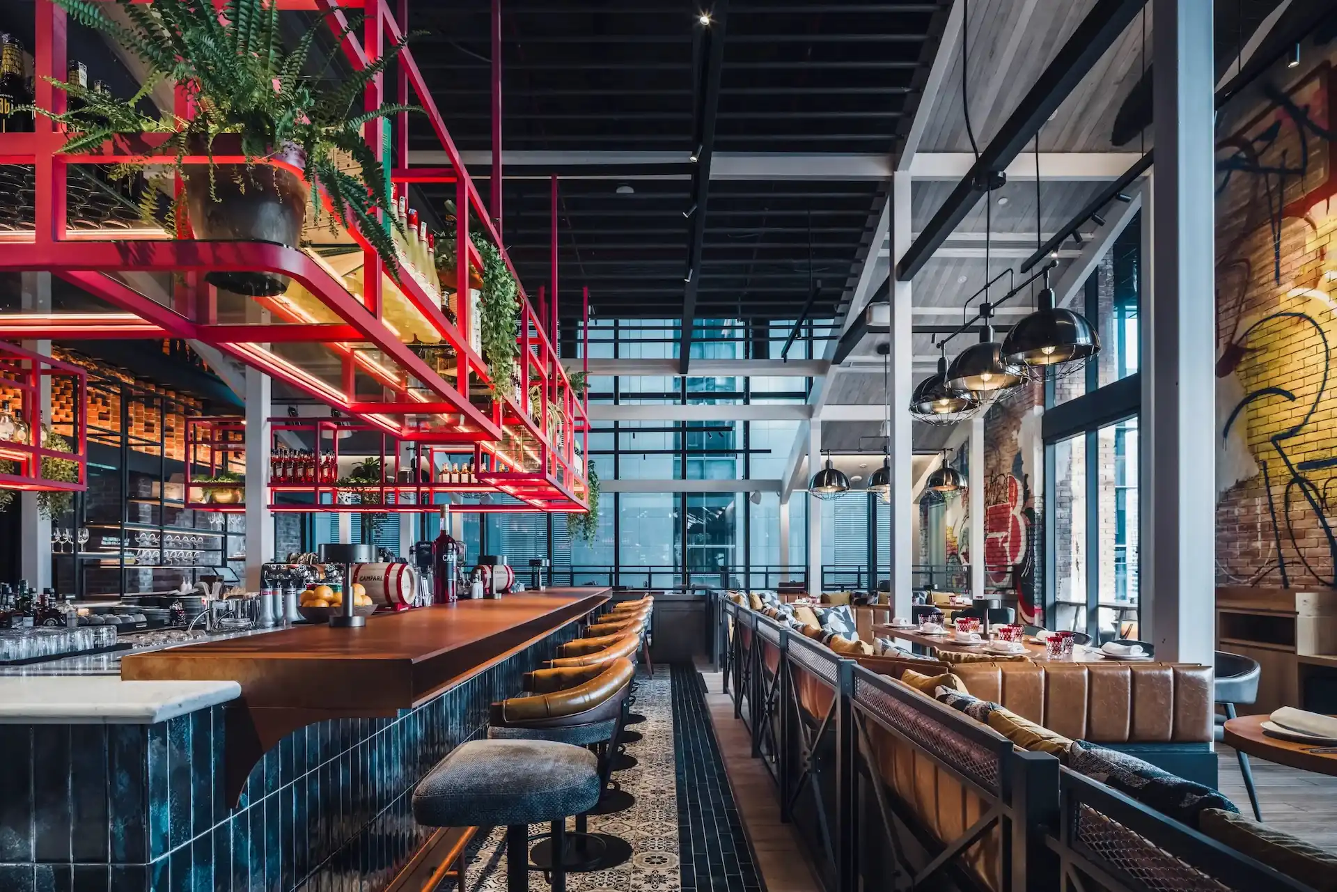 IL Forno at Hyatt Centric City Centre Kuala Lumpur, with The Foundry bar beneath a hanging pink steel gantry and graffiti artwork
