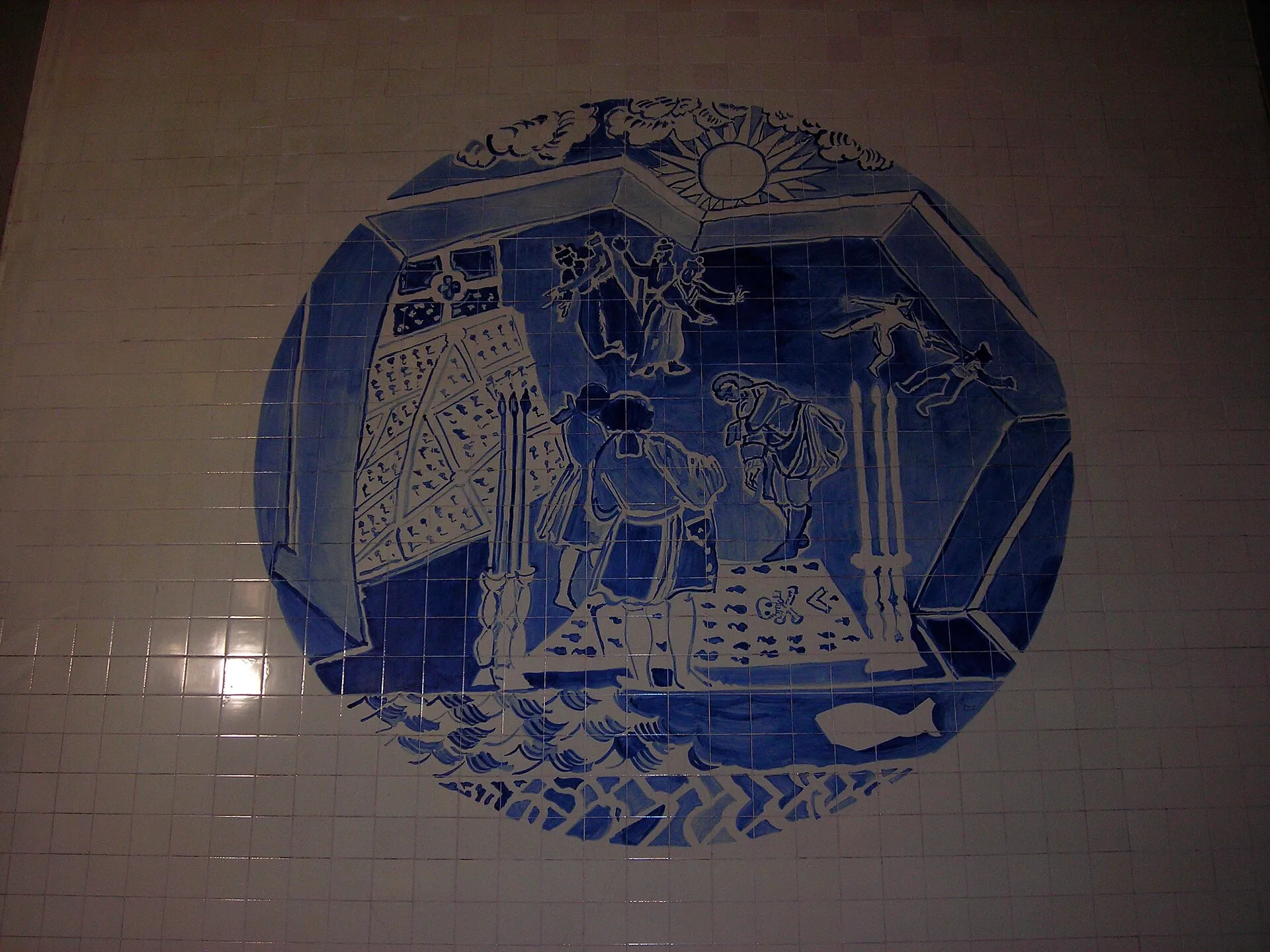 Blue and white painted azulejo tile panel on a wall in Lisbon