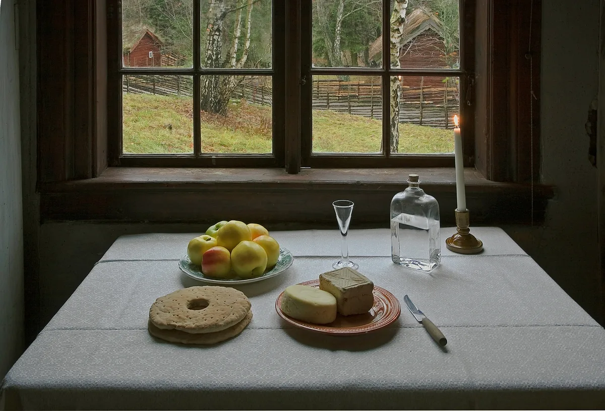 Brännvinsbord table with bread, cheese, apples and spirits