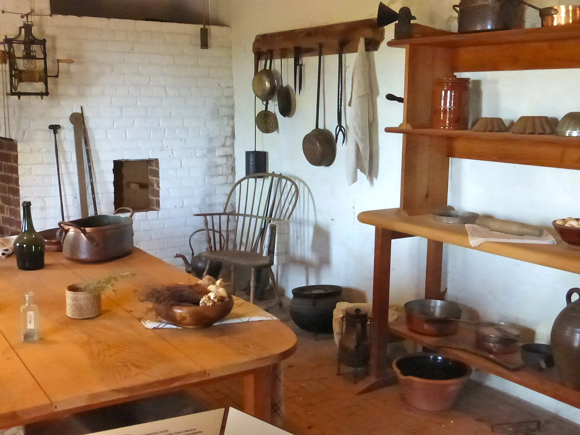Reconstructed historic kitchen with shelves of copper pans at Monticello