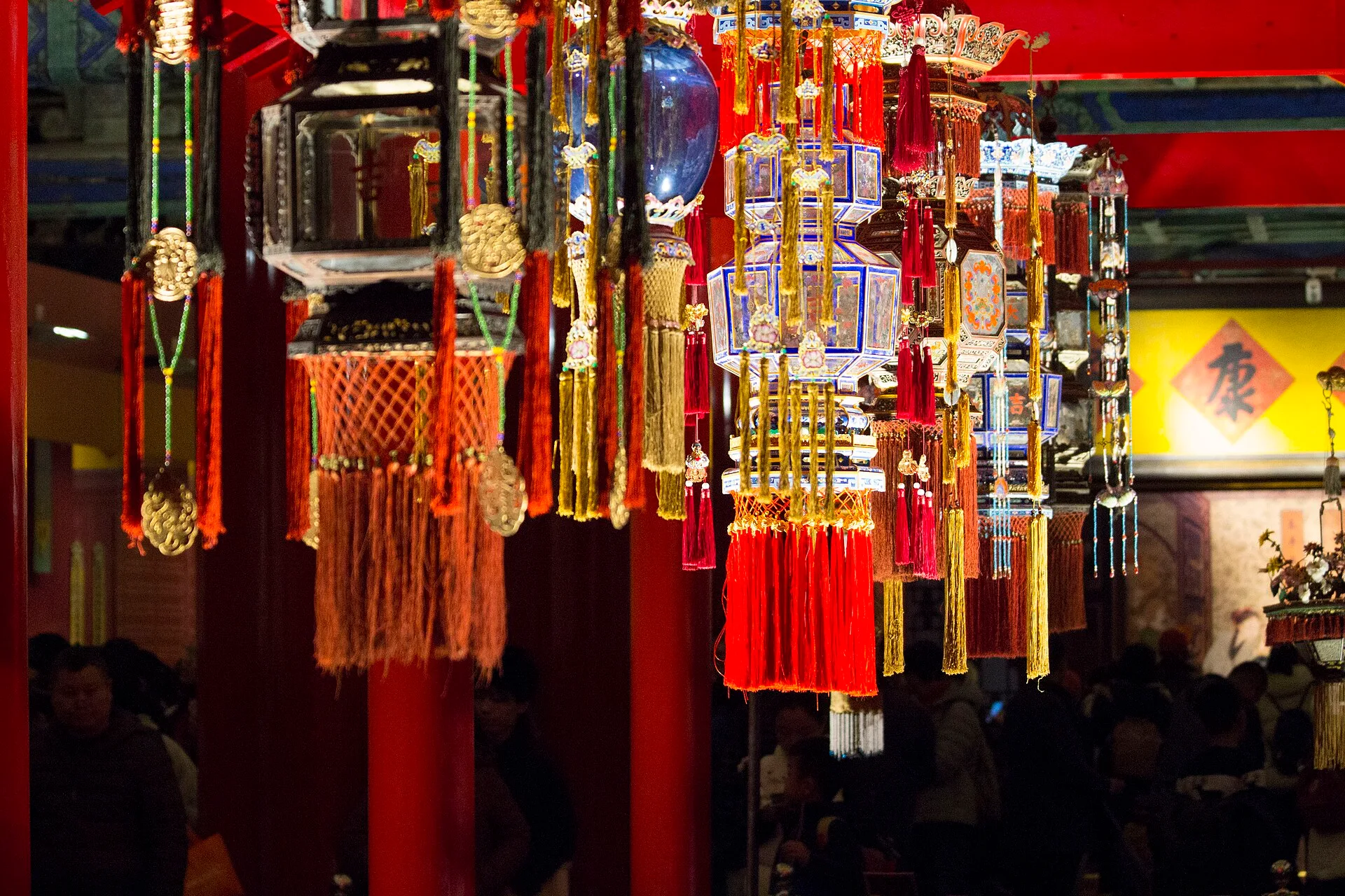 Hexagonal palace-style lanterns with red and gold tassels in the Forbidden City