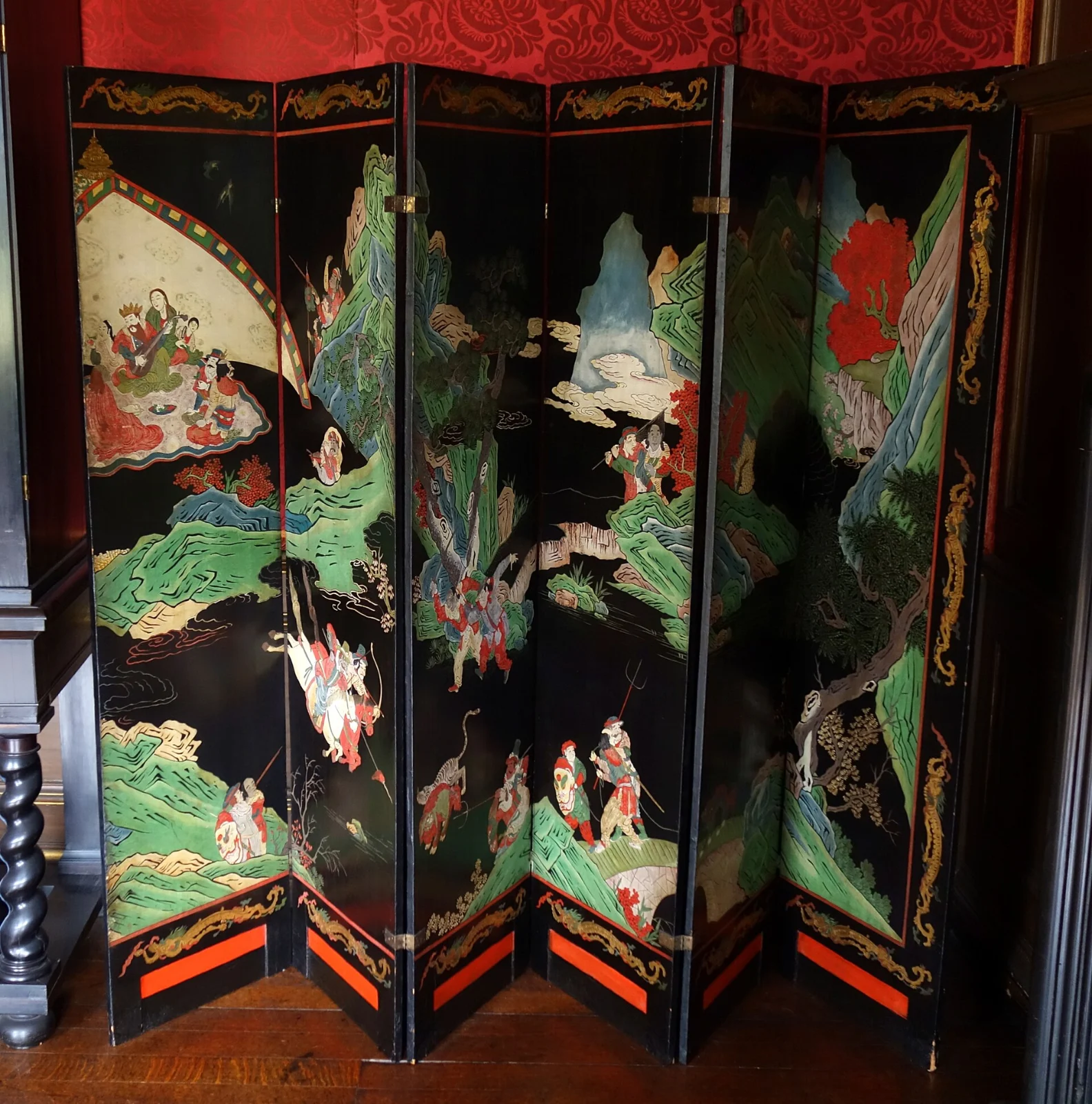 Folding screen with Coromandel lacquer panels and brass hinges at Ham House