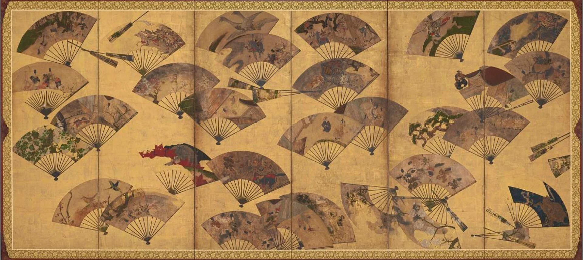 Gold folding screen painted with dozens of scattered open fans