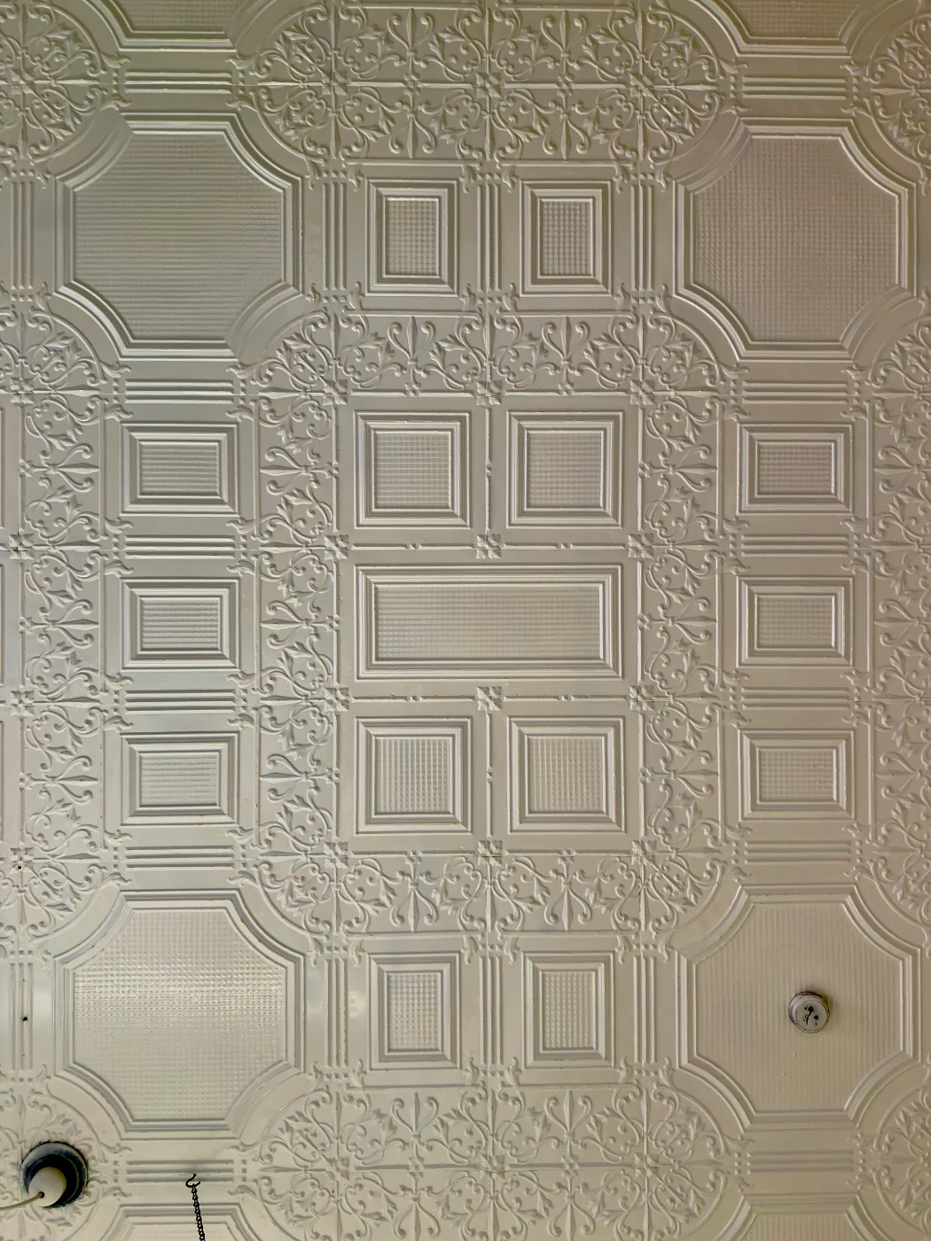 Painted pressed metal ceiling with square and octagonal panels