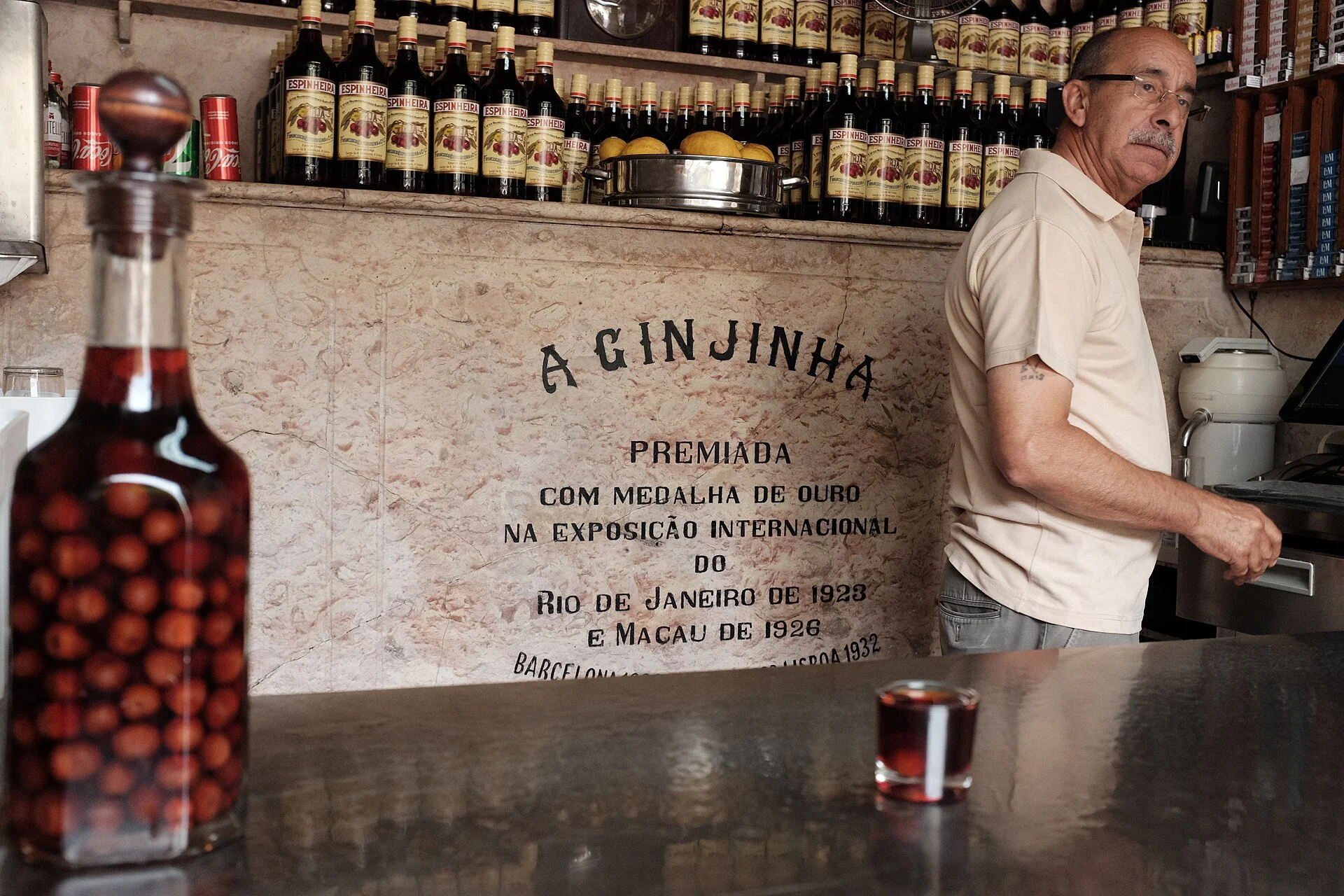 Bottle of cherry liqueur on the counter of A Ginjinha in Lisbon
