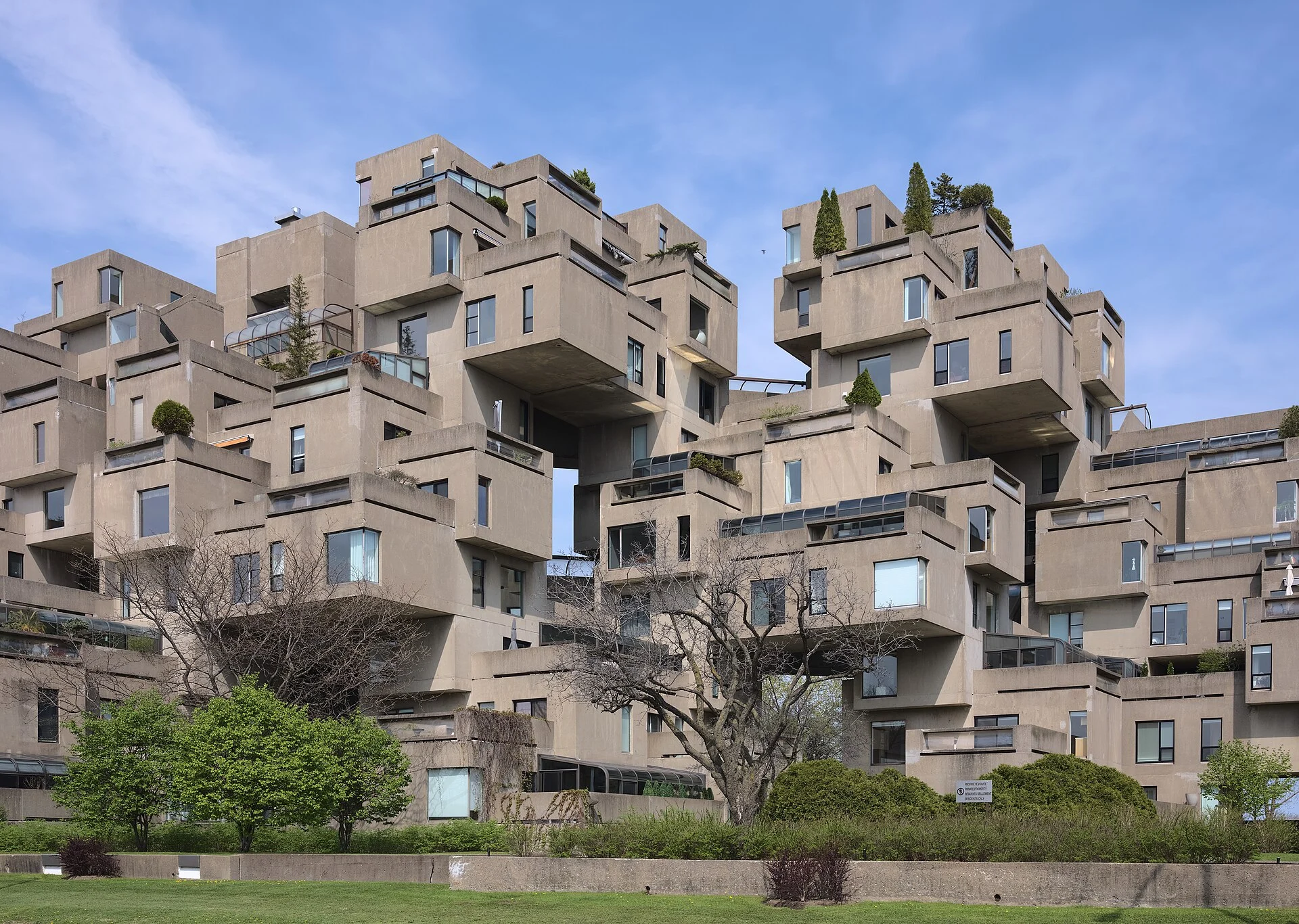 Stacked concrete housing modules of Habitat 67 beside the river in Montreal