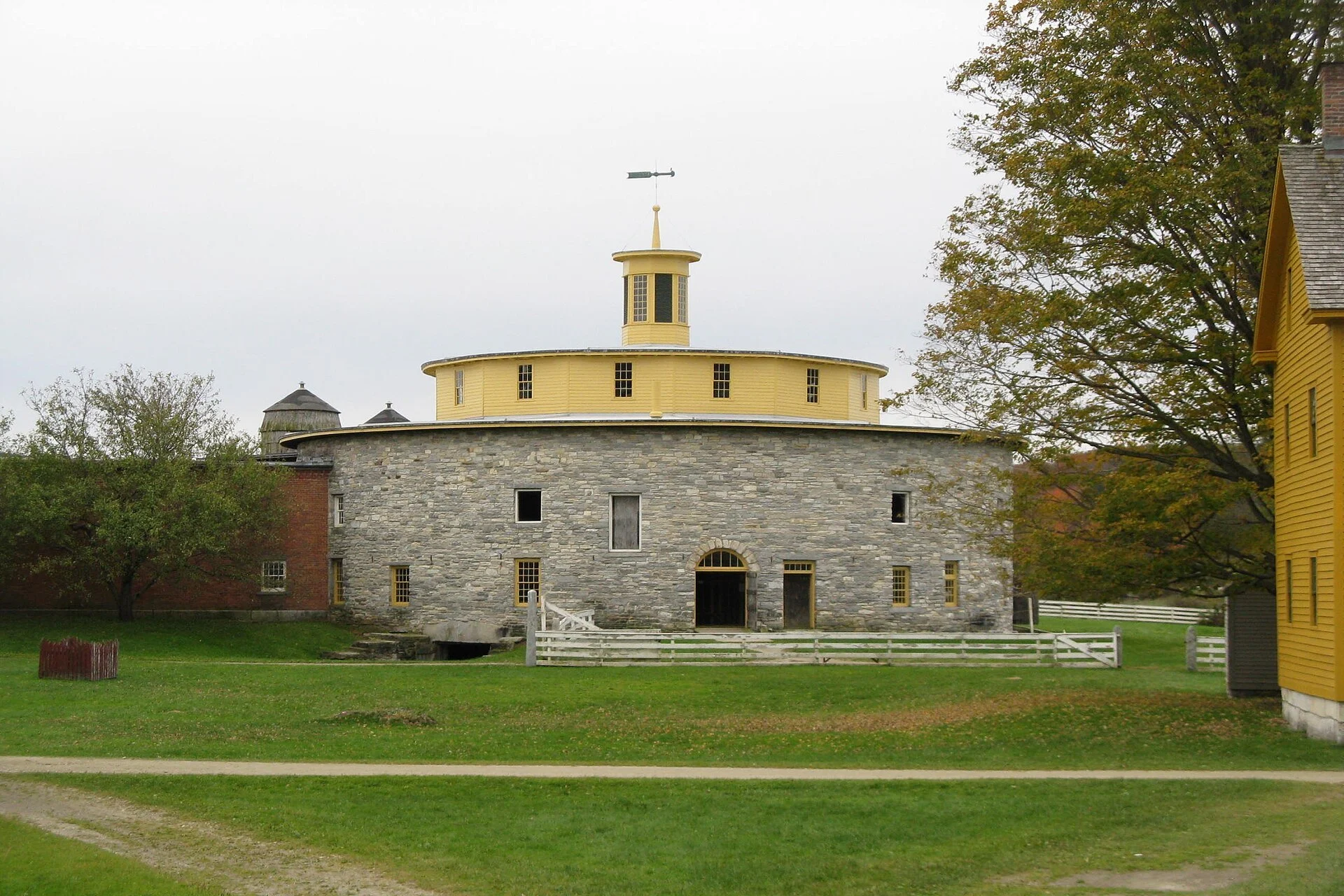 Circular stone barn with a timber cupola at Hancock Shaker Village
