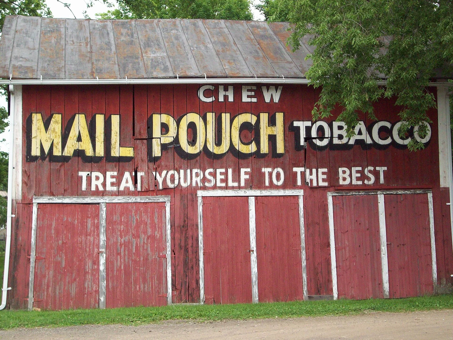 Red barn painted with a Chew Mail Pouch Tobacco advertisement