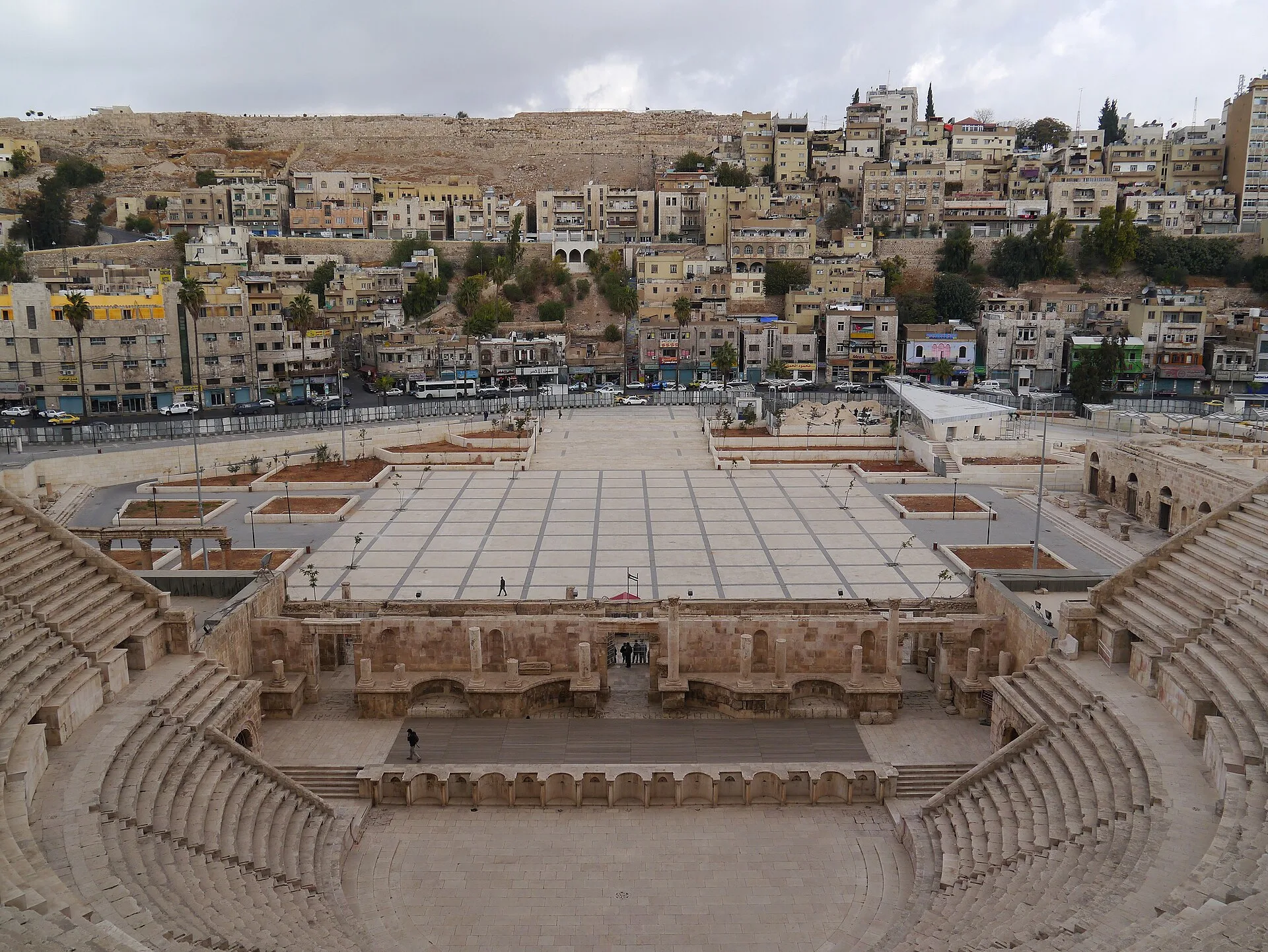 Tiered stone seating of the Amman Roman Theatre looking down to the stage
