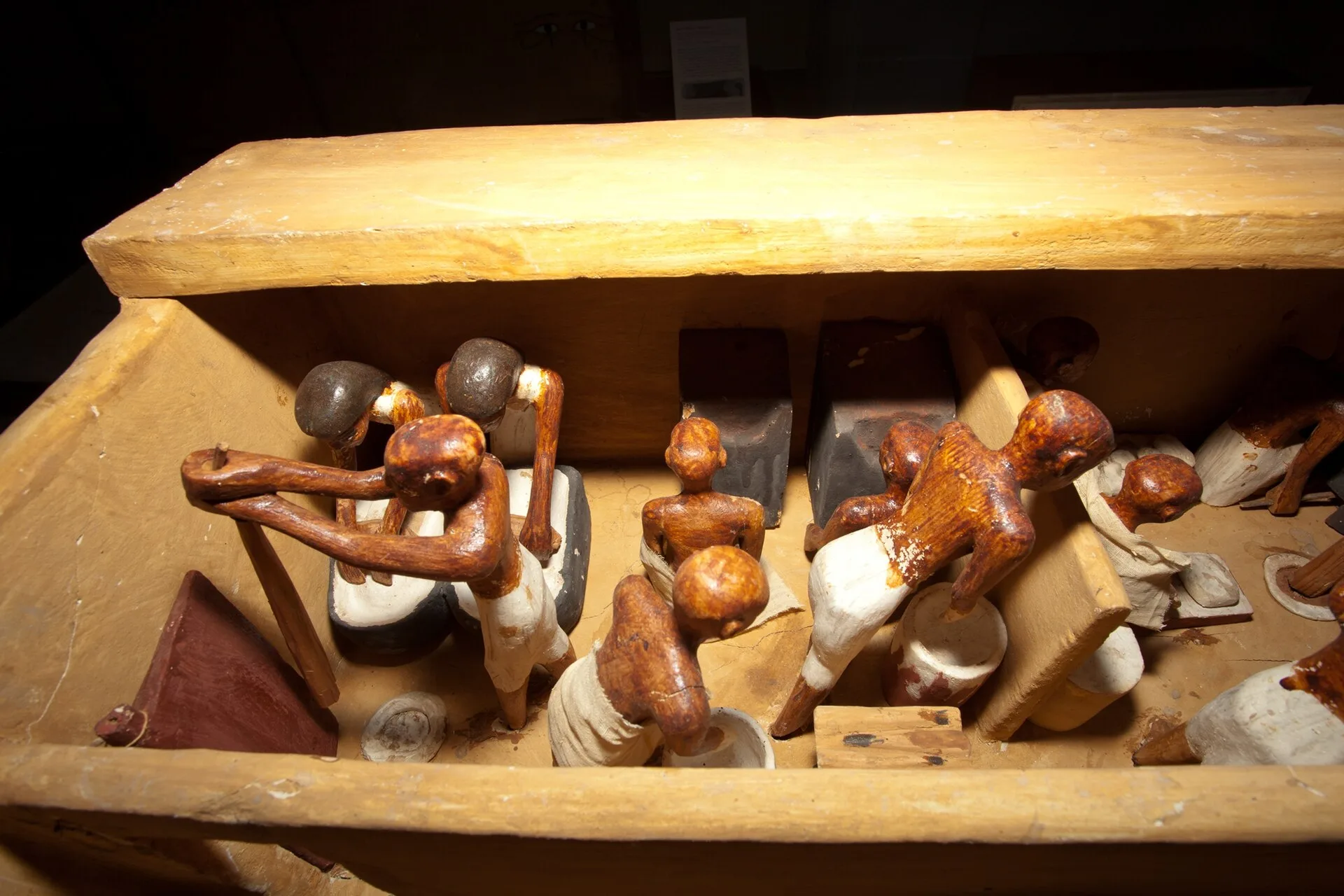 Wooden Egyptian tomb model of figures making bread and beer