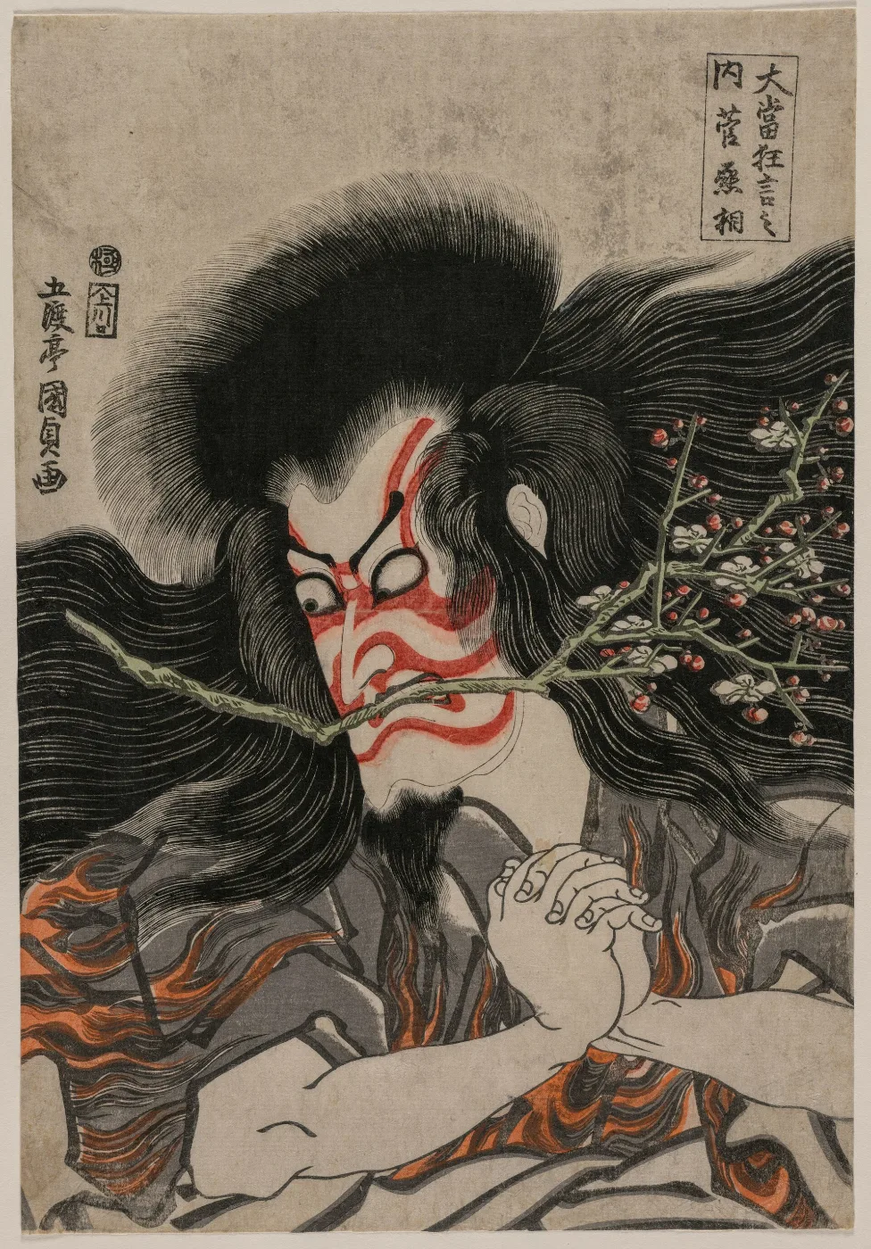Kabuki actor in red and white make-up glaring with crossed eyes and clenched mouth