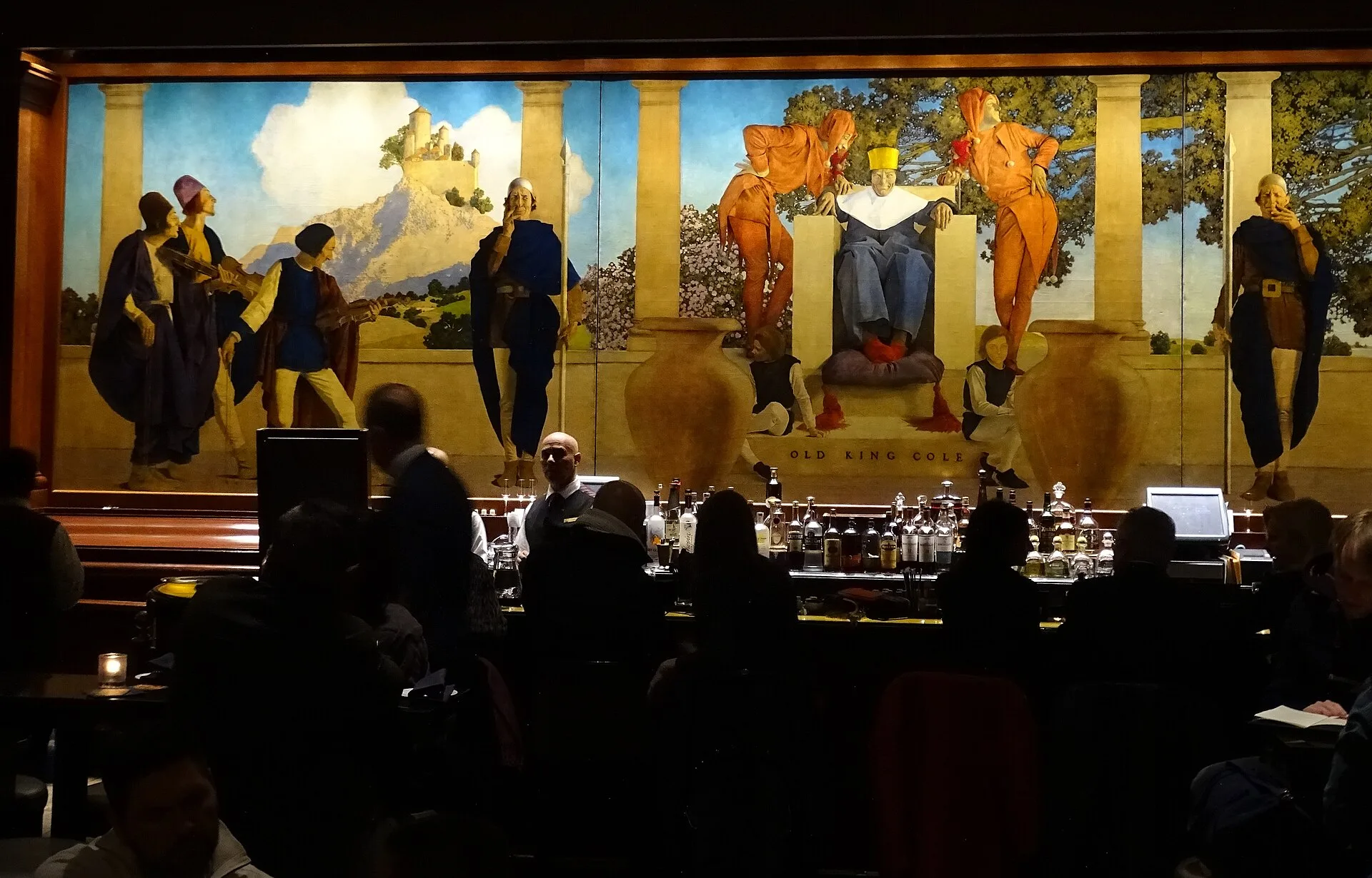 Hotel bar with a large painted mural above the back bar