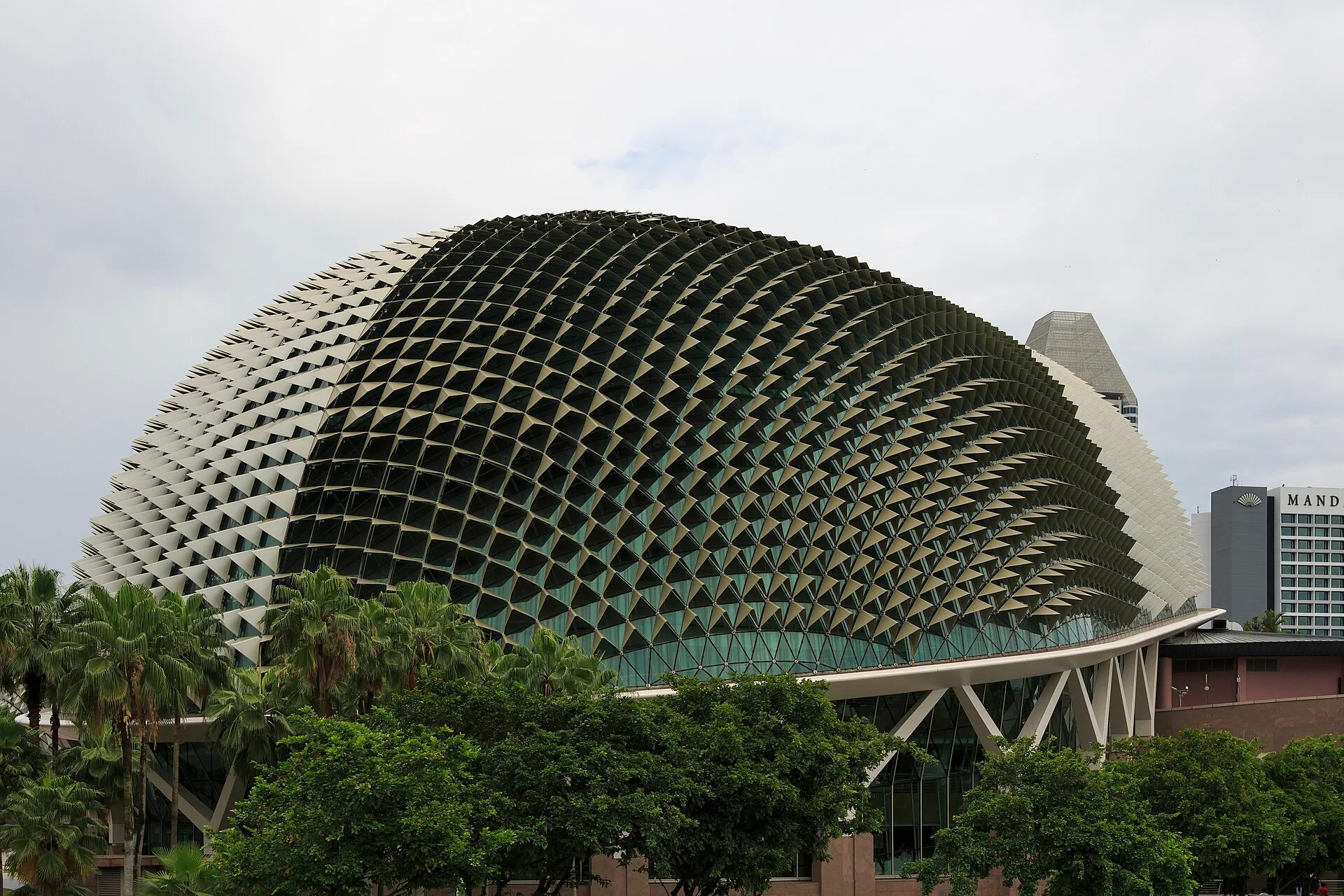 Spiked domed theatre building clad in angled sunshades
