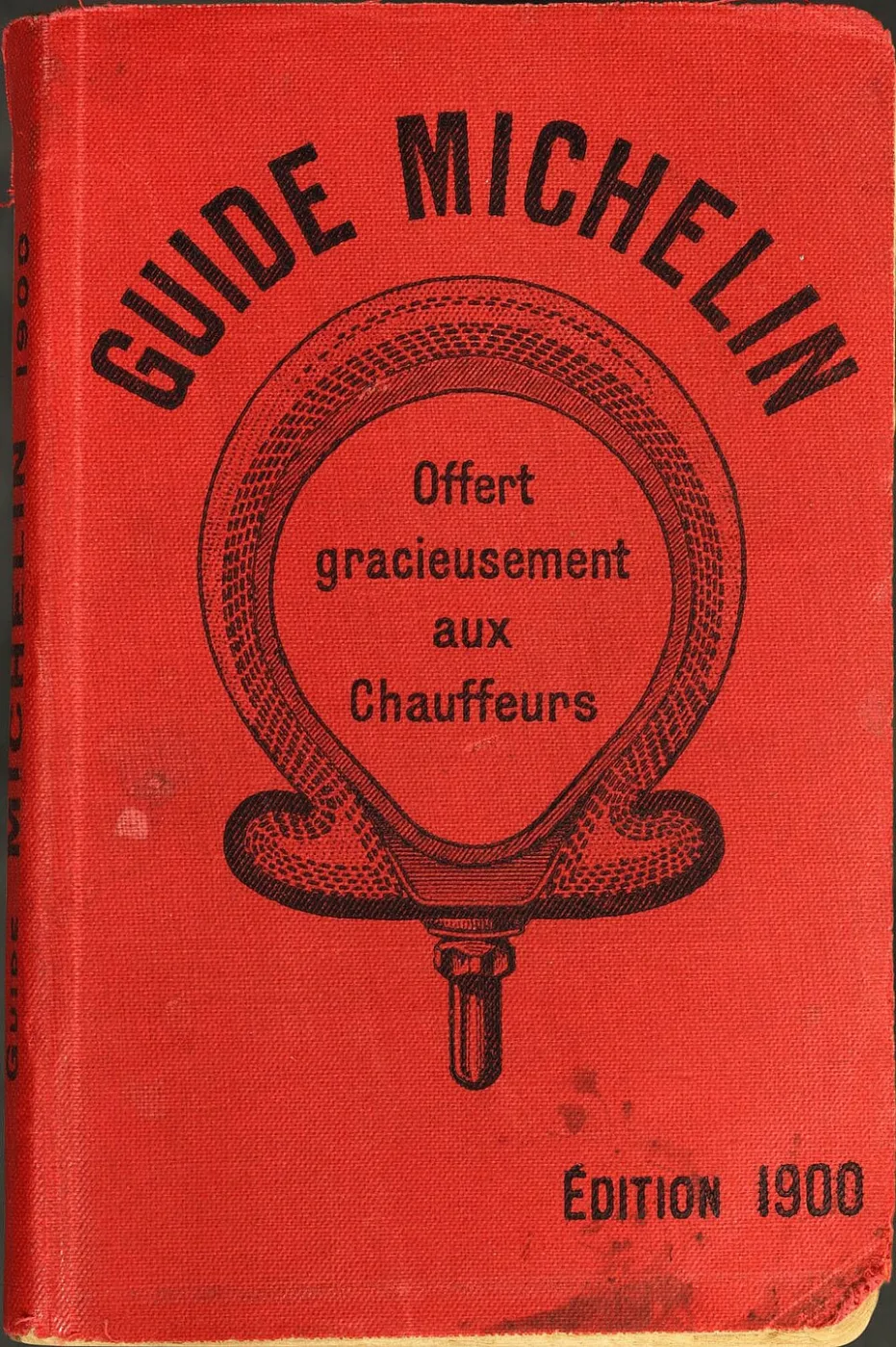 Red cover of an early Guide Michelin with its title in gold