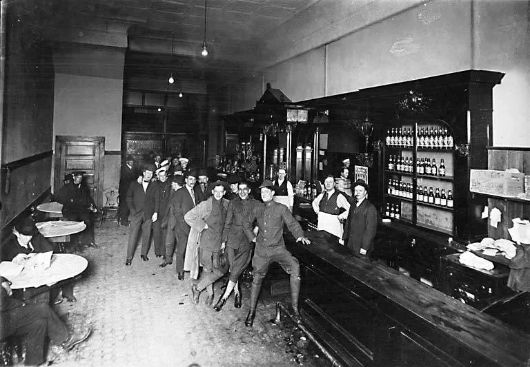 Black and white photograph of an early twentieth-century saloon bar interior