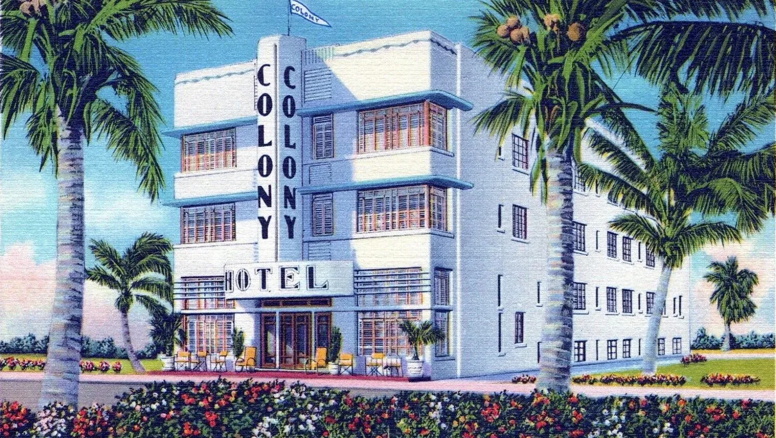 Coloured postcard of a white hotel with a vertical name sign among palms