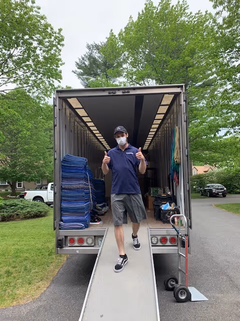Integrity Movers team member walking out of the truck
