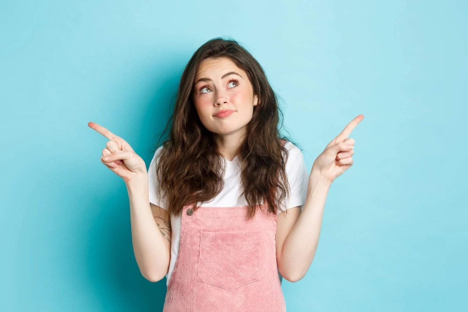 Person weighing options, pointing left and right - how to choose a VPN that is right for you