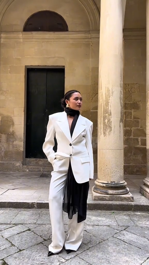 Image of a model in a white suit