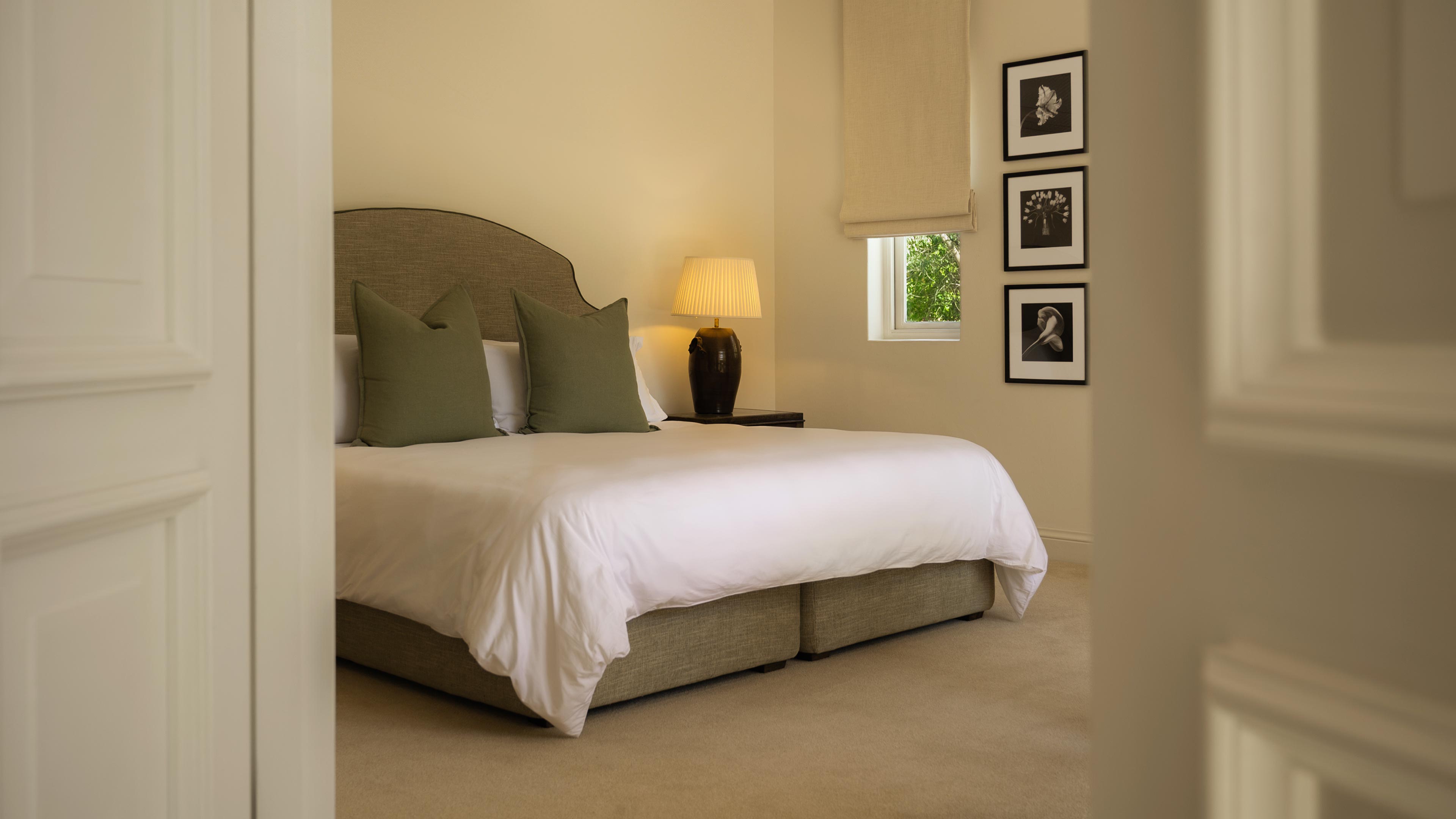 Le Marais is an elegant 35m² ground floor suite with a private terrace, fireplace and restful views of the garden and mountains beyond.