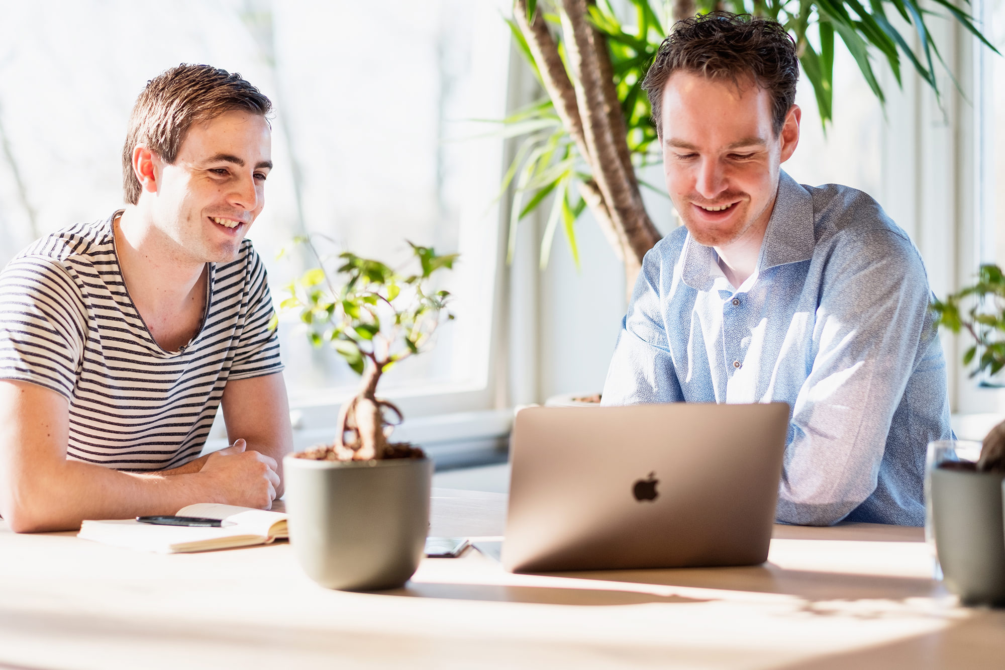Two developers looking at a computer