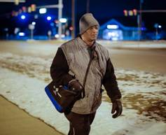 James Robertson, 56, of Detroit, makes his way along Crooks Road after working his shift at Schain Mold & Engineering in Rochester Hills on Friday, Jan. 9, 2015.