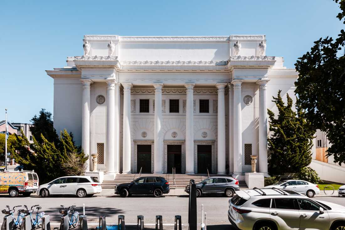 The exterior of Internet Archive office, which is a large white-columned Greek revival-style temple in San Francisco.